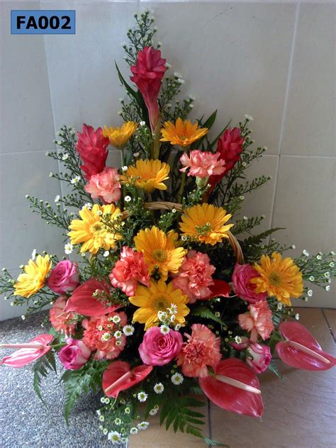 FA002: Triangle Arrangement of Carnations , Gerberas & Anthuriums ...