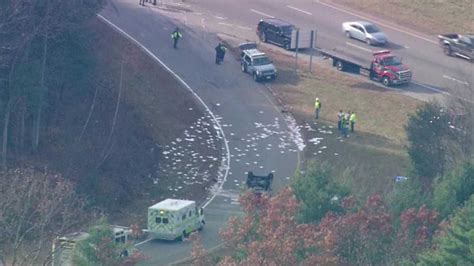 Truck flips over on highway exit ramp