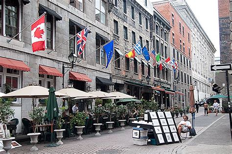 One of the many restaurant lined streets in Old Montreal, Canada. Old ...