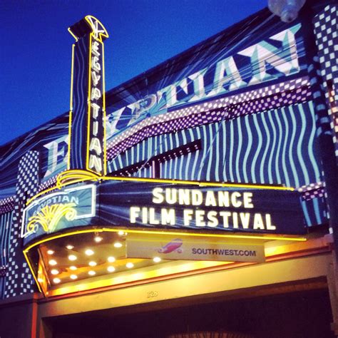 the marquee for the sun dance film festival is lit up at night time