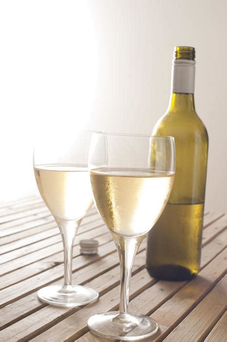 Free Stock Photo 11608 Two glasses of white wine with a bottle ...