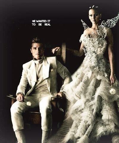 Peeta and Katniss in their wedding outfits that were worn to the interviews instead of their ...