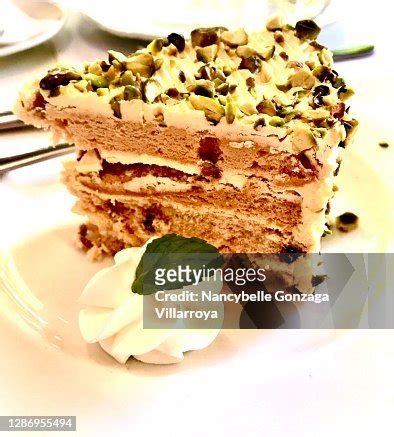 A Piece Of Sliced Cake With Pistachio Nuts High-Res Stock Photo - Getty Images