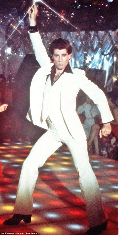 He's still got the fever! John Travolta looks positively giddy as he dances with shirtless ...