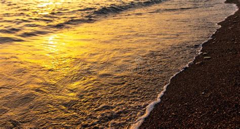 Waves on the Seashore at Sunset Stock Photo - Image of orange, water ...