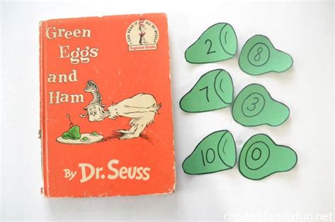 the green eggs and ham book is next to some cut outs with numbers on them