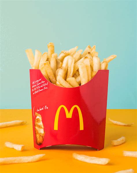 french fries in a mcdonald's bag on a table