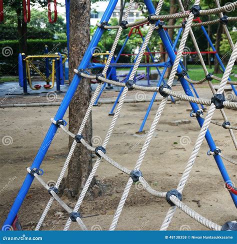 Climbing the Net at the Playground Stock Photo - Image of playing, outside: 48138358