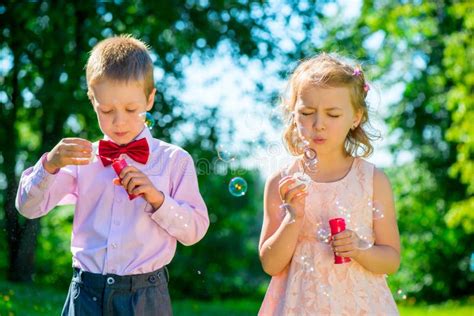 Happy Children Doing Soap Bubbles Stock Image - Image of enjoyment ...