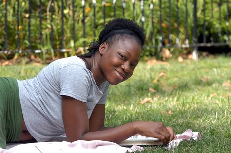 smiling girl with book | Every Child's Hope