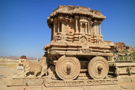 an intricately carved stone chariot in the middle of a desert area with ...