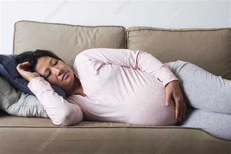 Tired pregnant woman - Stock Image - F031/0172 - Science Photo Library