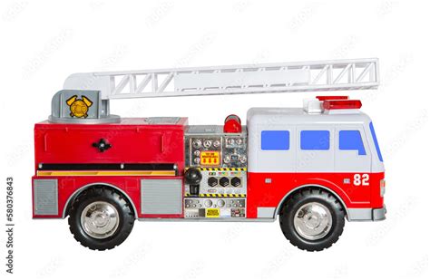 Toy red and white fire truck with blue windows, black wheels, white ladder, red flashing lights ...