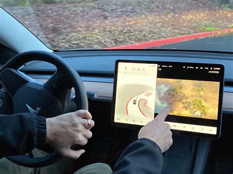 Tesla is under investigation over the potential for drivers to play ...