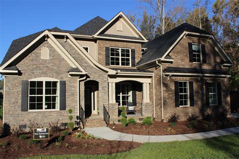 a large brick house with lots of windows