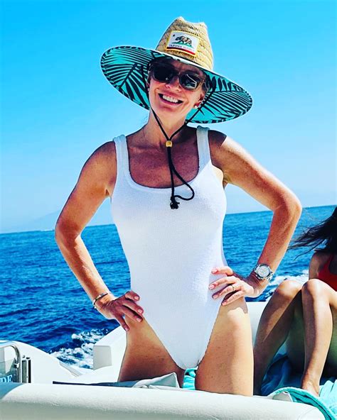 GMA3 host Dr Jen Ashton, 54, shows off flawless figure in a white swimsuit on boat ride during ...