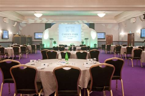 a banquet room set up with tables and chairs