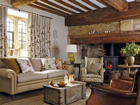 A welcoming country cottage sitting room with old beams and wood ...