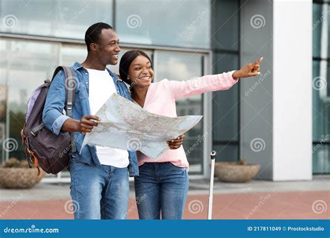 Travelling Together. Happy Black Couple with City Map Standing Near ...