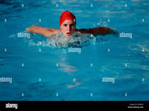 Woman swimming in pool. Butterfly stroke Stock Photo - Alamy