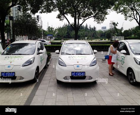 Roewe e50 electric cars of SAIC Motor for rental are parked in front of ...