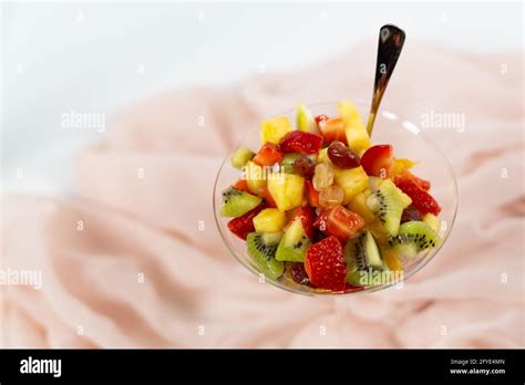 fresh fruit salad white background Stock Photo - Alamy