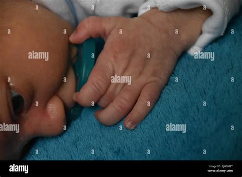 Newborn Baby Feet And Hands Stock Photo - Alamy