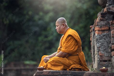 Buddhist monk meditation in temple Stock Photo | Adobe Stock