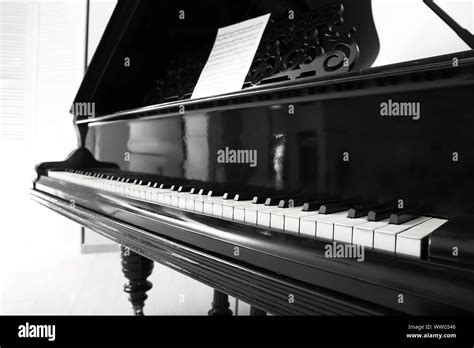 Black grand piano in room, closeup Stock Photo - Alamy