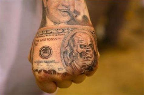 Money Tattoos - Inked Magazine | Money tattoo, Dollar tattoo, Hand tattoos