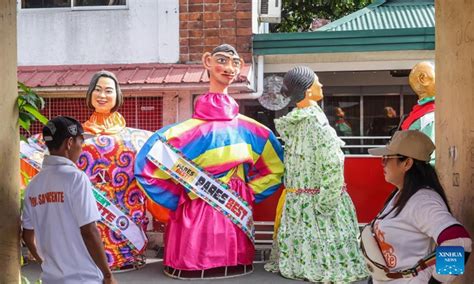 Papier-mache puppets paraded to celebrate Higantes Festival in ...