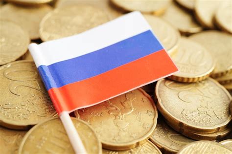 Premium Photo | Russia flag on coins background finance and accounting banking concept