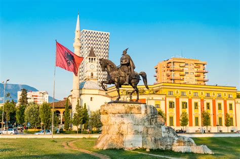 Skanderbeg square with flag, Skanderbeg monument and The Et’hem Bey Mosque in the center of ...