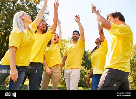 Young people in a circle during an exercise for team building and ...