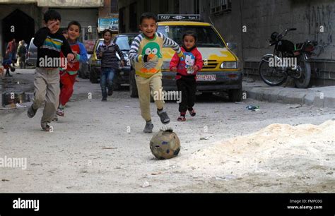 Damascus, Syria. 12th Mar, 2016. Children play soccer in the southern ...