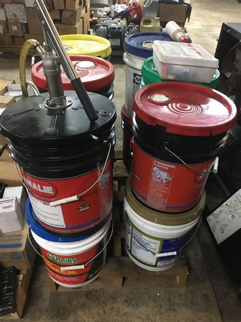 Pallet Lot of 5 Gallon oil Pails and Hand Pump