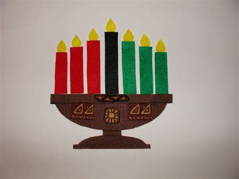 Kwanzaa candles in a kinara. I sing a song to the tune of "Twinkle ...