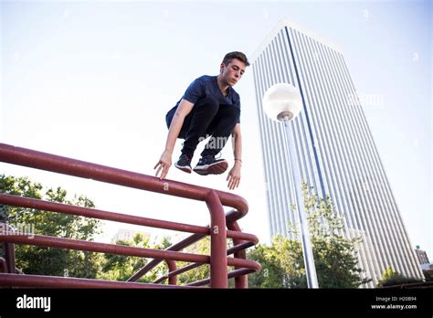 Man jumping over fence in city hi-res stock photography and images - Alamy