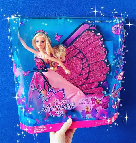 a barbie doll in a pink dress and butterfly wings on the back of a package