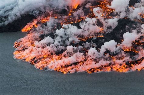 A lava flow meeting the sea in Iceland : woahdude