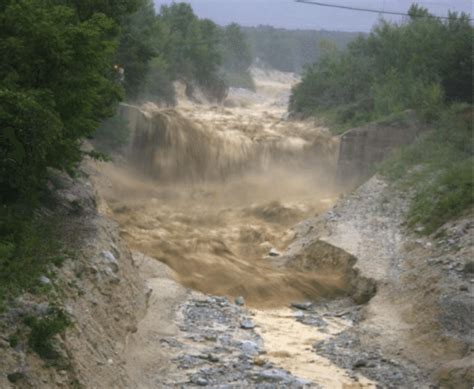 Photo of Illgraben debris flow event near Check Dam 28. Source: Brian ...