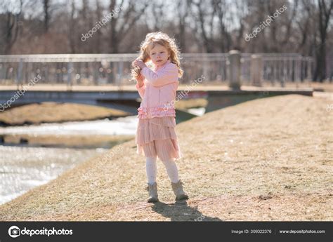 Little girl walking alone in the city park and enjoy. Stock Photo by ...