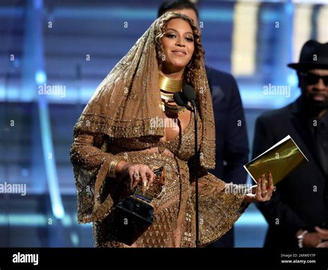 Beyonce accepts the award for best urban contemporary album for ...