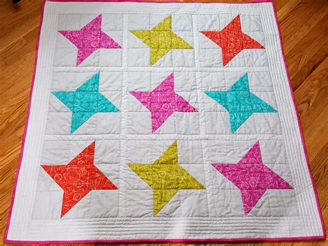 Love the simplicity and the straight line quilting just on the borders ...