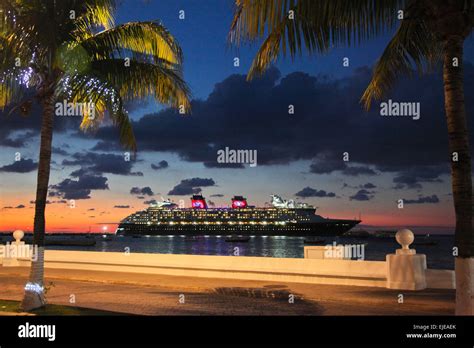 Disney Cruise ship docked in Cozumel Mexico, ready to set sail at sunset Stock Photo - Alamy