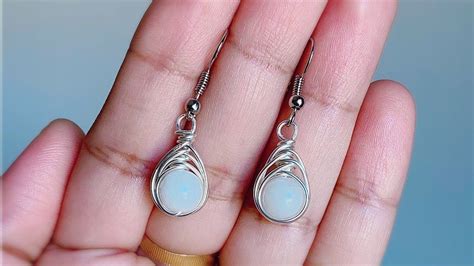 wire wrapped earrings/simple white bead earrings in 2020 | Diy earrings easy, Diy earrings ...