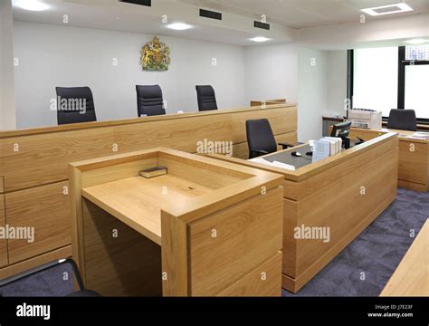 Interior of a modern, English courtroom. Shows judges/magistrates bench ...