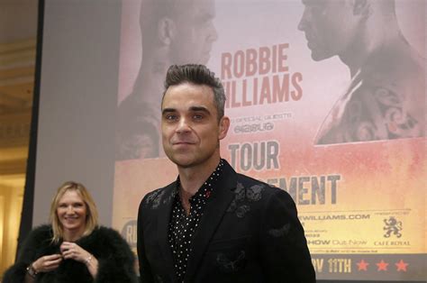 Robbie Williams sees Take That reunion 'at some point' but not soon ...