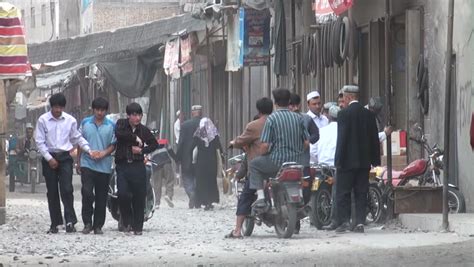 HOTAN - 10 SEPTEMBER 2010: Motorbikes, Cars, Donkey Cart Commute In Hotan, China. Hotan Has ...