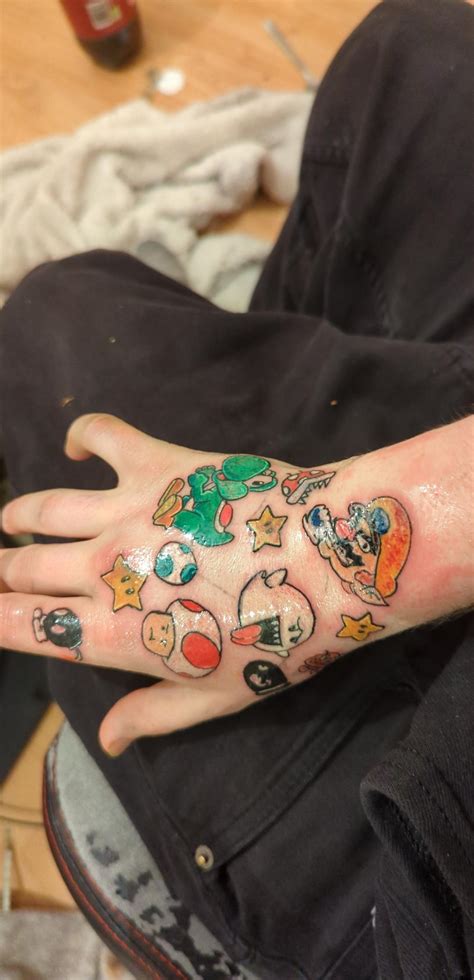 new mario hand tattoos done by diino at the 3 angles studio in Bradford : r/tattoo